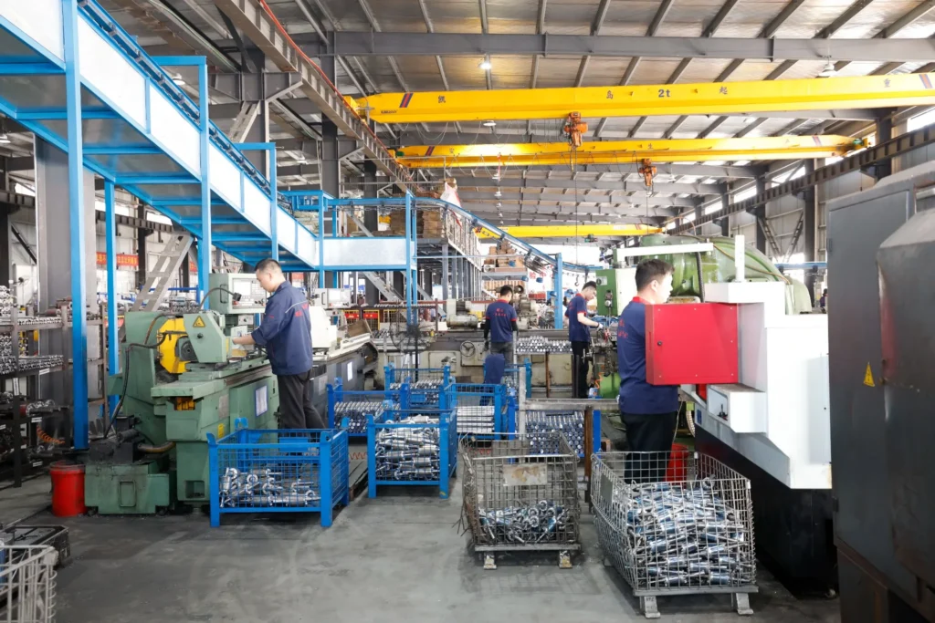 Motor shaft CNC machining workshop with operators