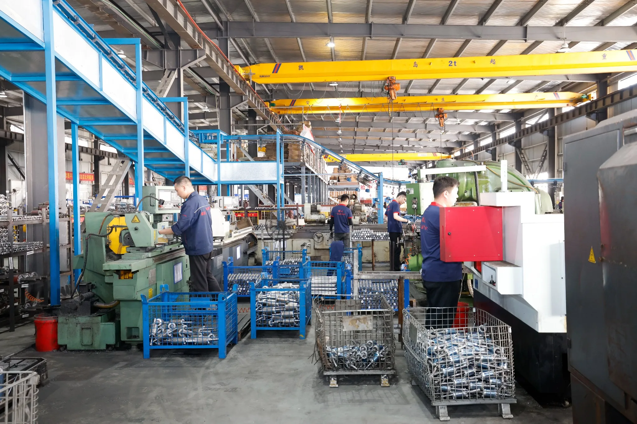 Motor shaft CNC machining workshop with operators