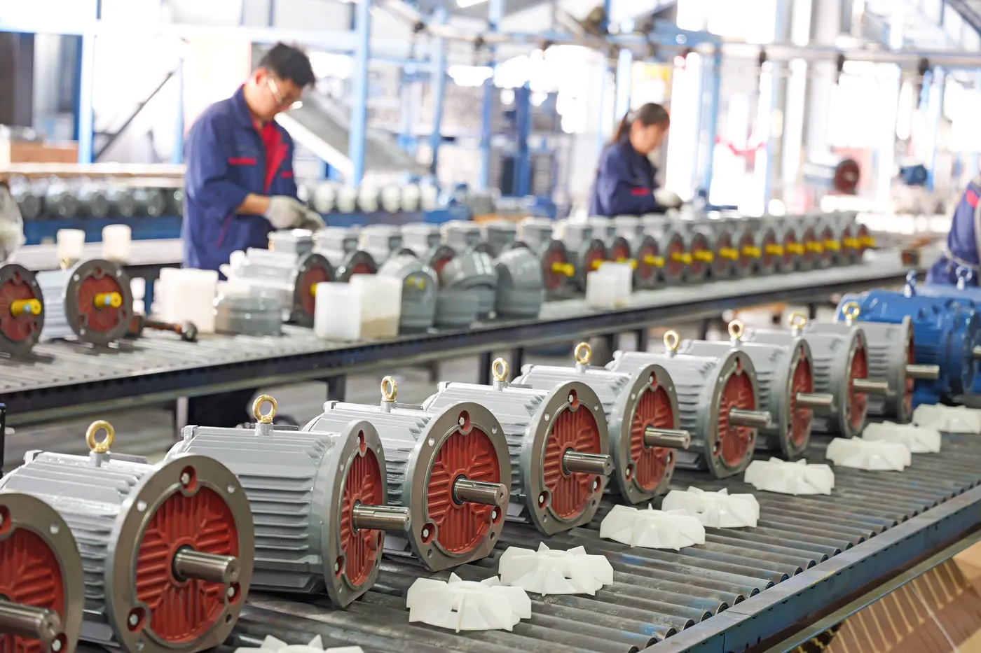 Packaging workshop motor assembly line with finished electric motors on conveyor