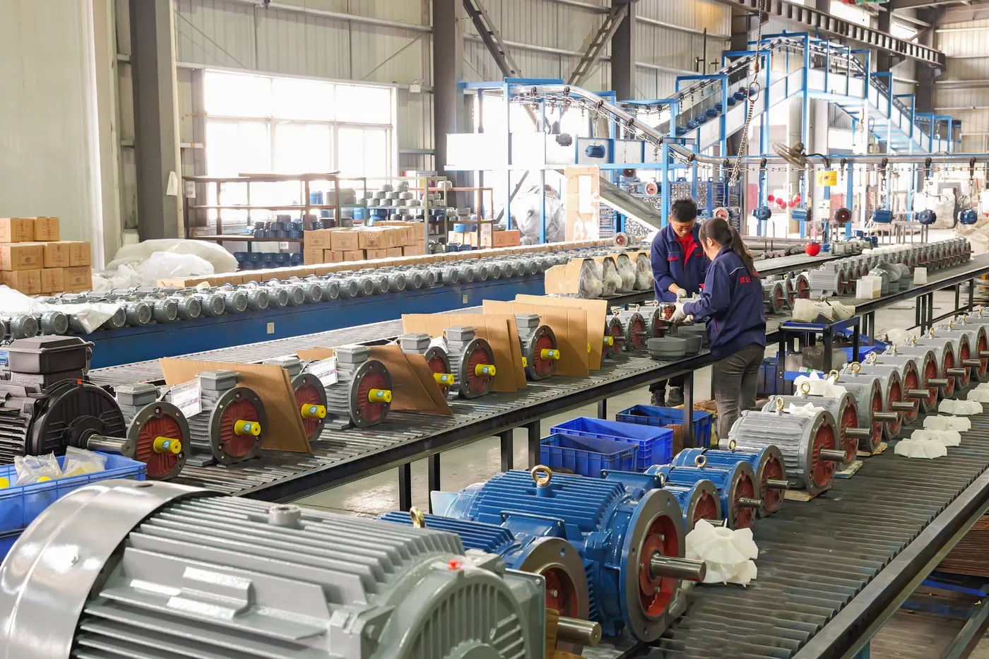 Finished electric motors prepared on conveyor before packaging